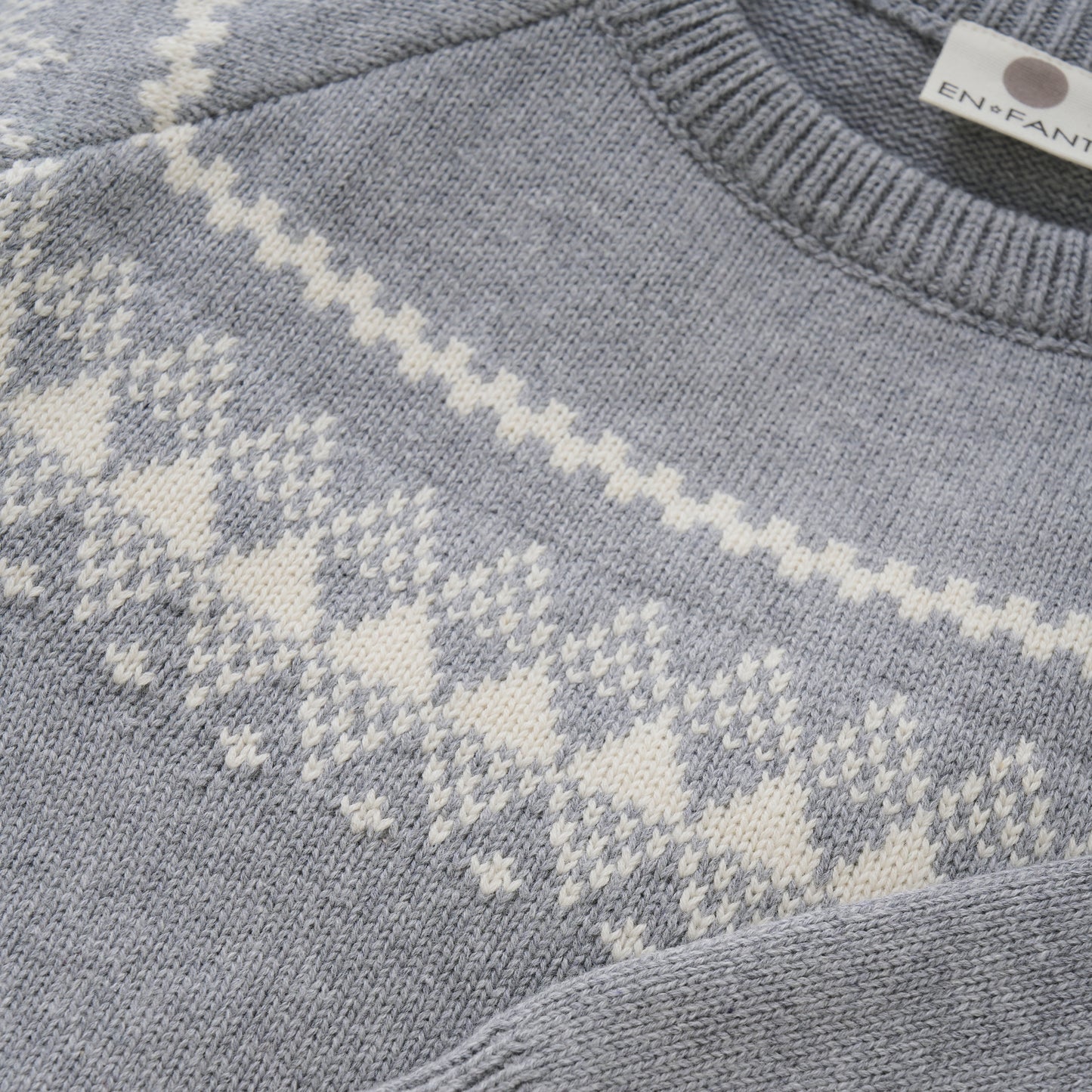 En Fant Strickpullover aus Wolle