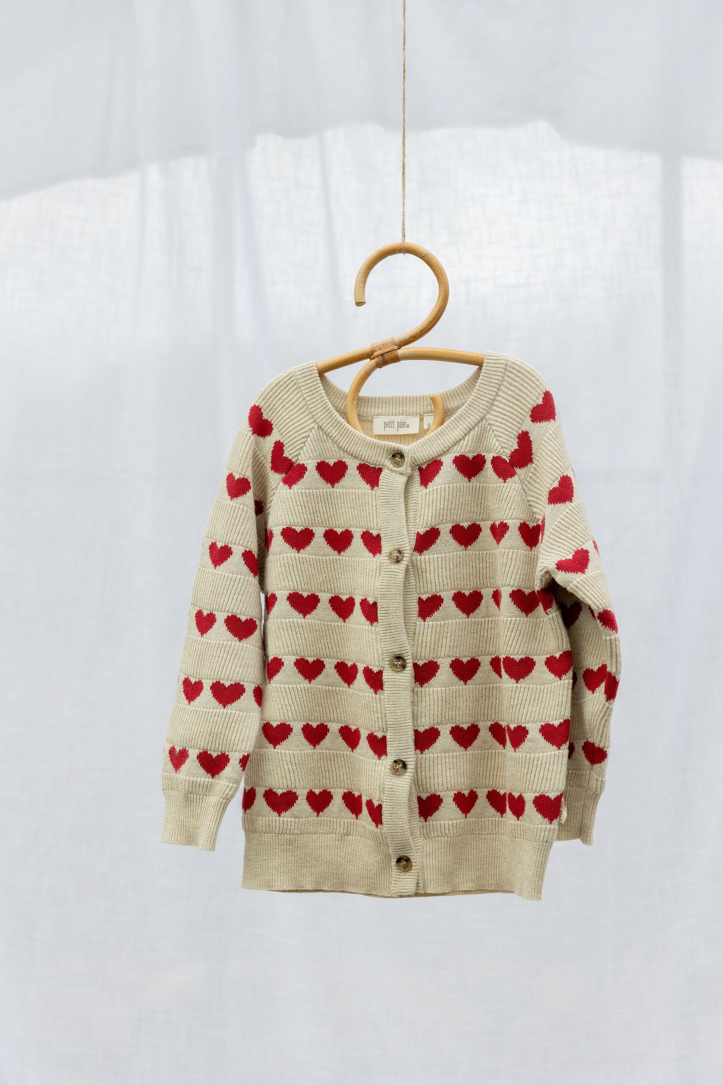 Petit Piao Strickjacke mit Herzmuster