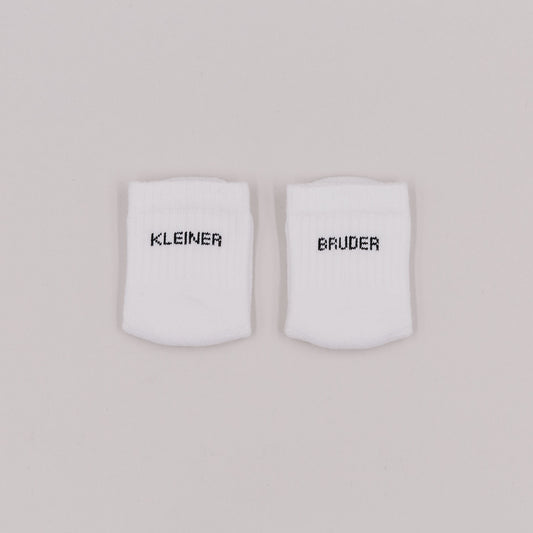 Eulenschnitt Baby Socken "Kleiner Bruder"