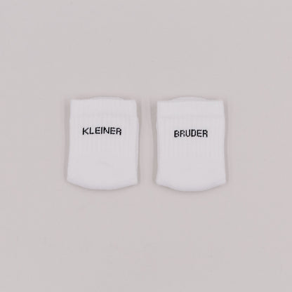 Eulenschnitt Baby Socken "Kleiner Bruder"